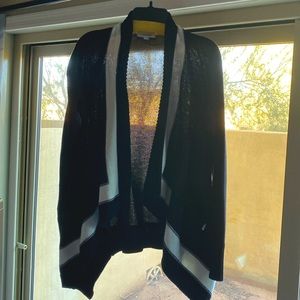 Calvin Klein sweater with pockets. It’s warm and long.